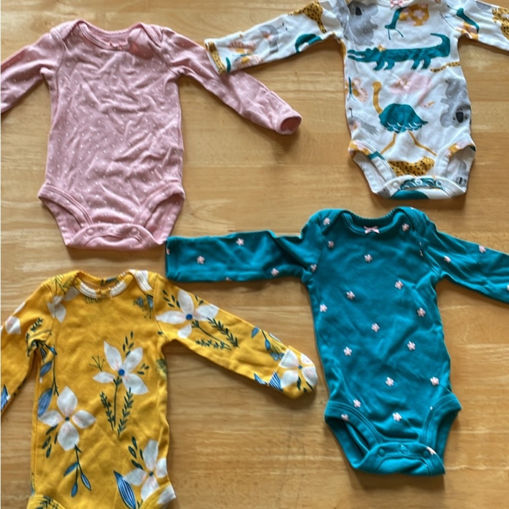 Carters 4 pack of newborn long sleeve onesies.